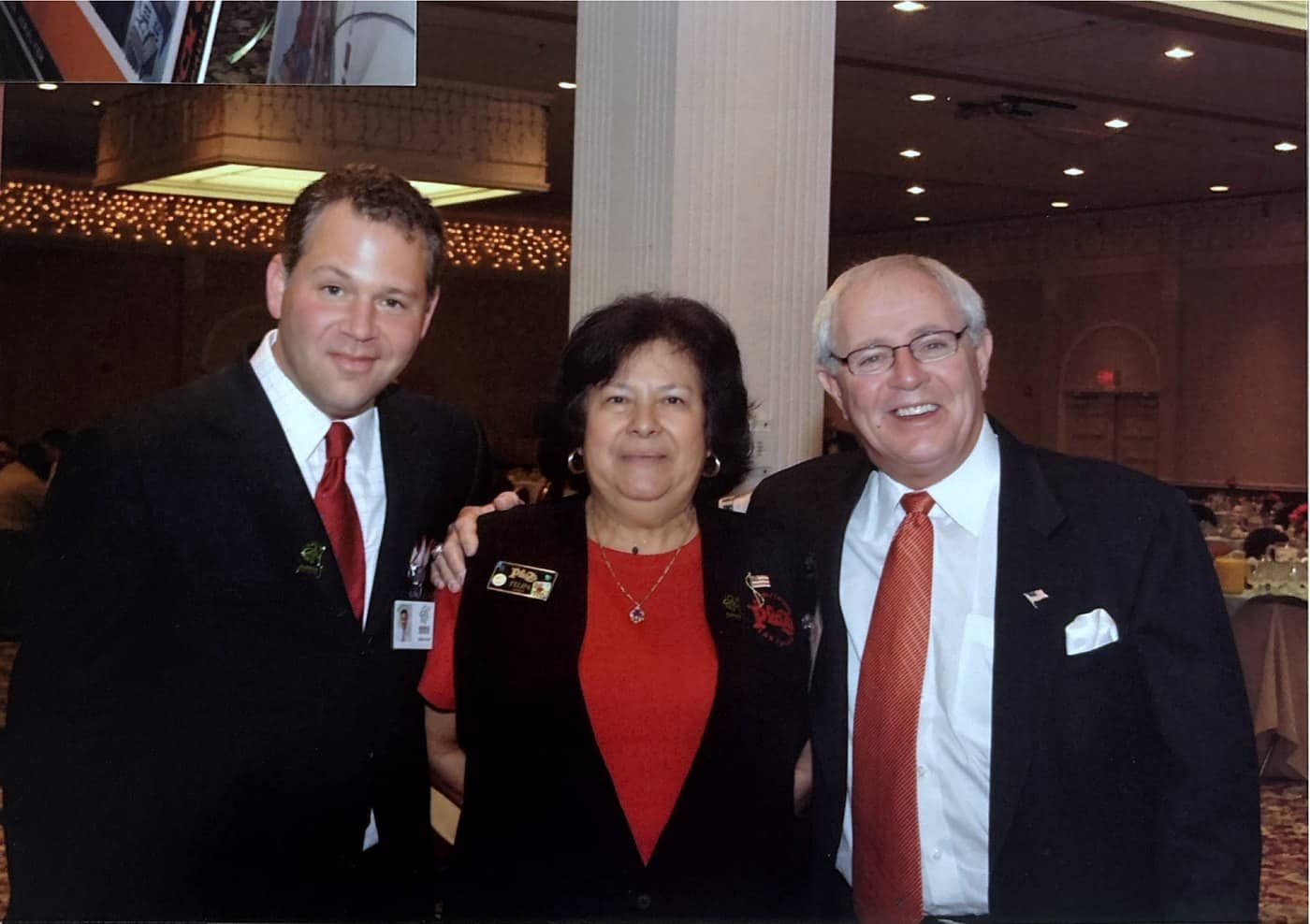 Three people standing together on the casino floor during the Barrick Gaming opening.