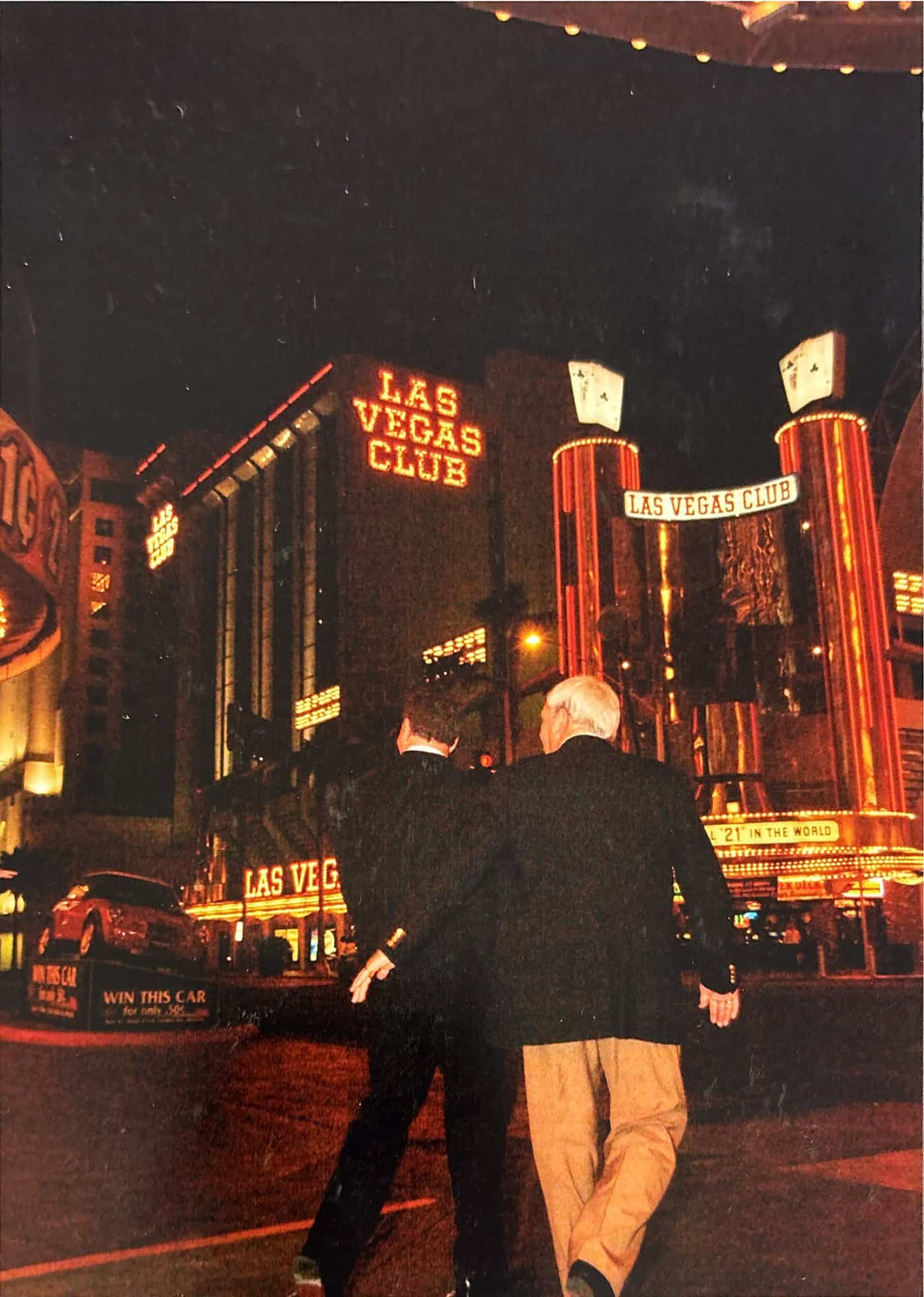 The neon facade of the Las Vegas Club hotel and casino lit at night on Fremont Street.