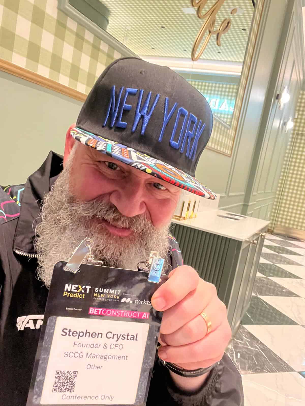 Stephen Crystal with his NEXTPredict Summit New York badge