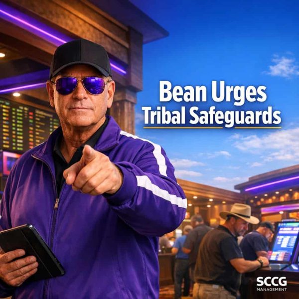 David Z. Bean stands commandingly on a vibrant tribal casino sportsbook floor holding a compliance tablet and pointing forward with authority amid active betting kiosks and glowing odds boards.